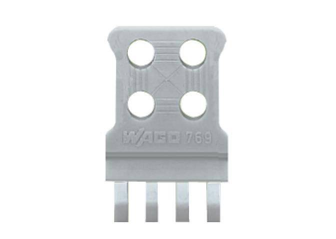 A grey, rectangular plastic component with four round holes and four flat pins at the bottom. Brand name 'WAGO 769' embossed.