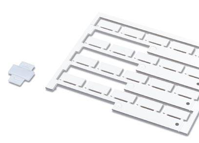 White, rectangular plastic plate with punched-out sections and a separate small white piece.