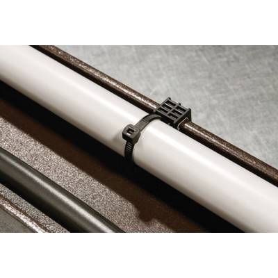 A white pipe is secured to a metal surface with a black cable tie. A black cable runs alongside it.