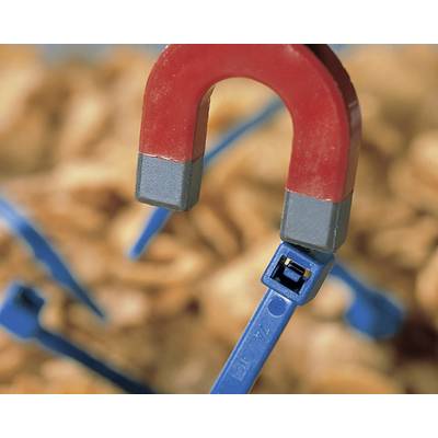 A red magnet attracts a blue screw. Background blurred, focus on magnet and screw. Symbolises magnetic attraction.