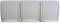 Three identical white light switches side by side.