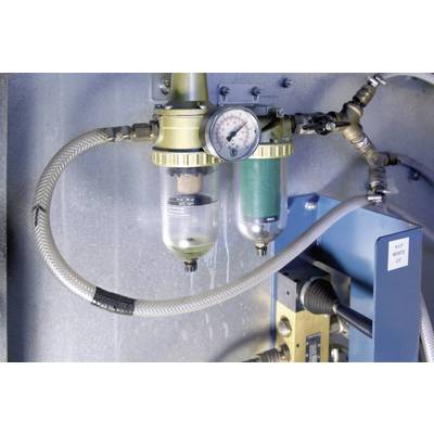 A pneumatic pressure regulator with pressure gauge and two filters in a technical setting. Cables and hoses are connected.