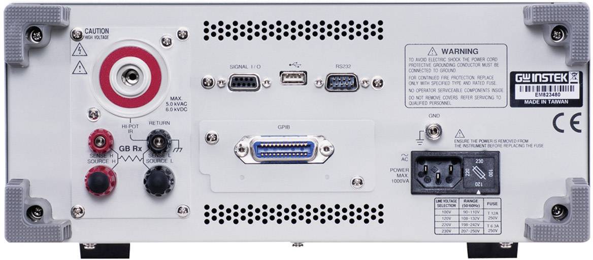 'Rear of an electronic device with connections and warning notices.'