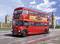 A red double-decker bus is driving over a bridge in London. The Big Ben and the British Parliament are visible in the background.