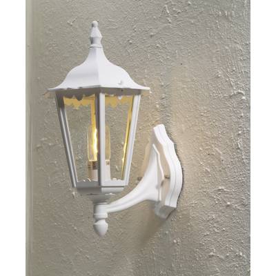 White outdoor wall lantern with transparent glass panes mounted on a textured wall. The lamp is switched on and glowing warmly.
