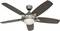 Ceiling fan with five wooden blades and metal housing, with a light fixture built into the centre. Suitable for indoor spaces to improve air circulation.