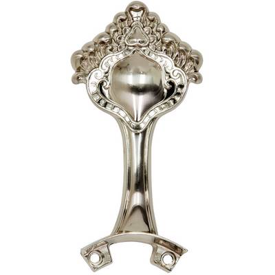 Metal bottle opener with artistic embellishments, suitable for wall mounting.