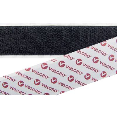 A black hook and loop fastener strip lies next to a protective film printed with the 'Velcro' logo.