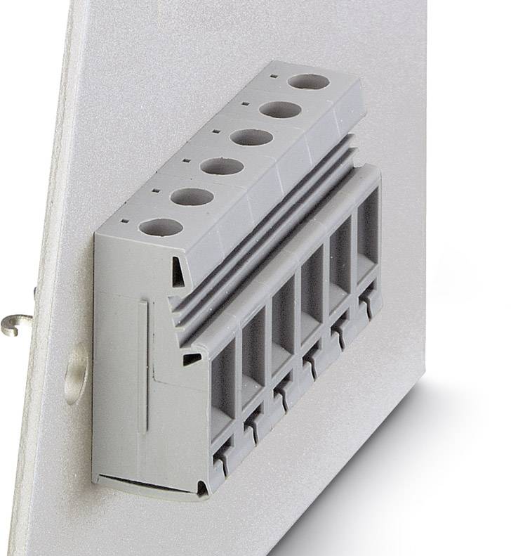 Grey electrical connector with six connection openings, mounted on a metal plate, shown from a side perspective.