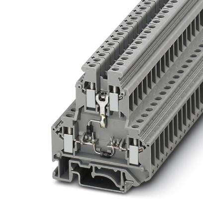 Grey plastic terminal block mounted on a rail, with multiple cable connections.