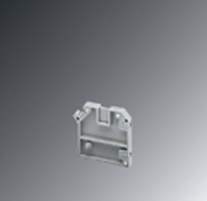 A small, grey, rectangular plastic item with recesses and holes, possibly an enclosure for electronic components.