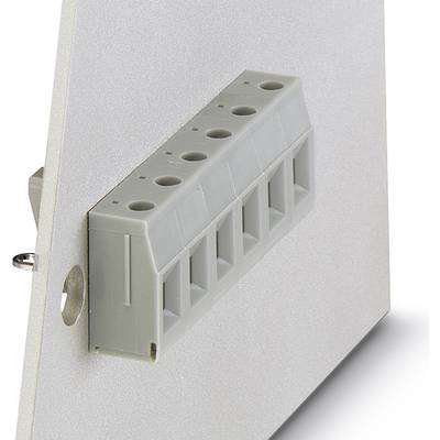 A grey electrical connector on a metal surface for electrical connections, photographed slightly at an angle to the camera.