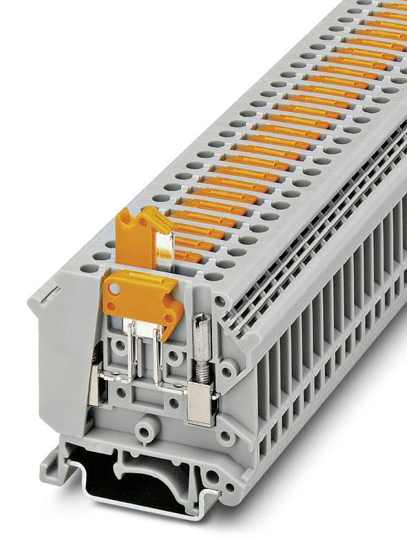 A grey terminal block with orange levers, used for electrical connections in control cabinets.