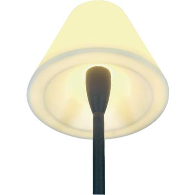 Floor lamp with a pale yellow shade and black stand, casting a warm light.