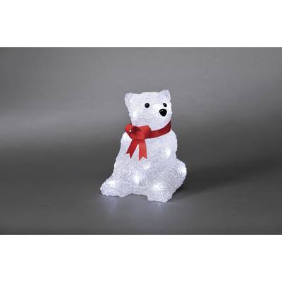 A decorative polar bear made of transparent material with illuminating elements, wearing a red bow around its neck against a grey background.