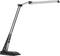 Black desk lamp with adjustable arm and flat LED light head, suitable for desk or reading purposes.