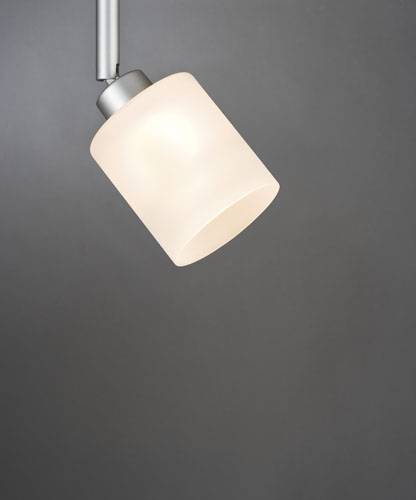 A single, simple pendant light with a cylindrical, white shade hangs in front of a neutral grey wall.