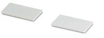 Two rectangular, white ceramic tiles side by side on a white background.