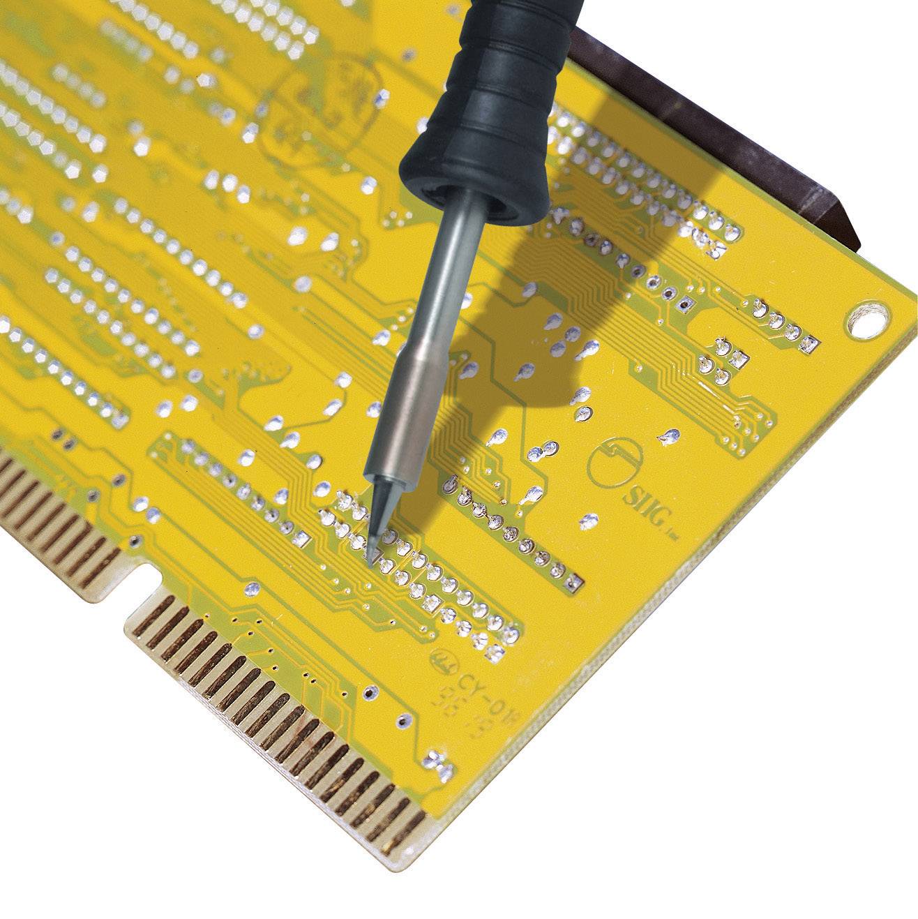 Close-up of a yellow circuit board with a soldering iron touching a connection point.
