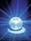 Small crystal ball radiates blue light in all directions on a dark surface, creating a sparkling effect.