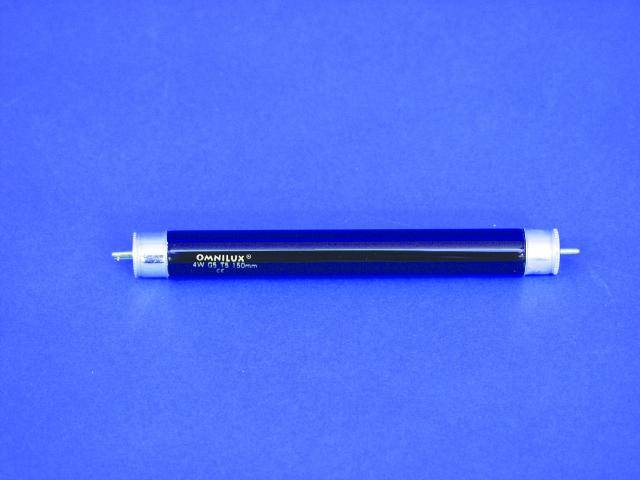 A black light source lying on a blue background. The lamp has cylindrical ends and is intended for illumination.