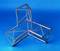 A triangular space frame component made of metal tubes against a blue background, demonstrating complex structural connections.