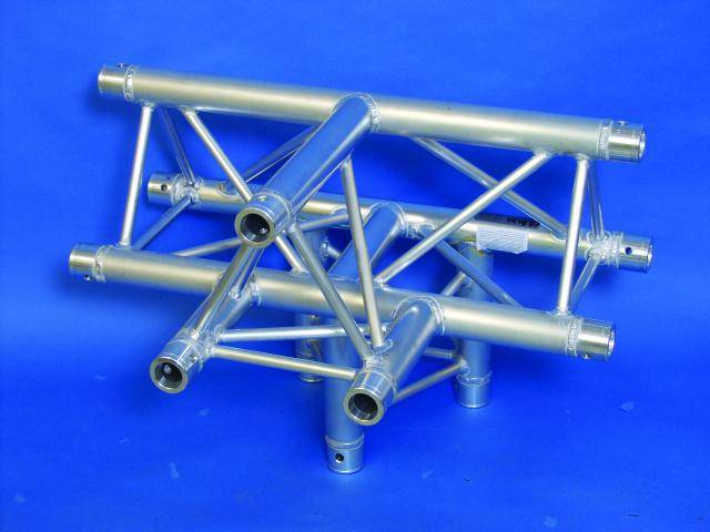 A silver-coloured metal frame, consisting of several cylindrical tubes and struts, against a blue background.