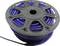 A black cable reel with star-shaped apertures, containing a coiled blue cable.