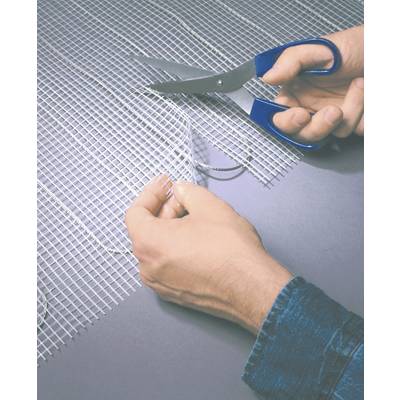 A person is cutting a mesh-like material with blue scissors. The hands are in focus and show the cutting process.