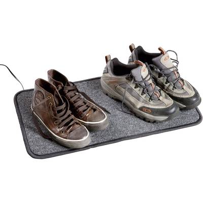 A few brown trainers and a pair of hiking boots are standing side by side on a grey doormat.