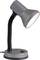 Grey desk lamp with a flexible neck, pointing to the right. The lamp is switched on and shining brightly.