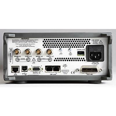 'Back of an electronic device with multiple ports and interfaces, including a power connection and BNC connectors.'