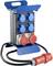 A mobile electrical distribution board with multiple blue and red sockets and an attached cable, suitable for construction sites.