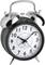 A black, classic alarm clock with two bells shows 10:10.