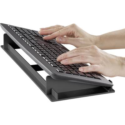'Hands typing on an angled, ergonomic keyboard on a stand.'