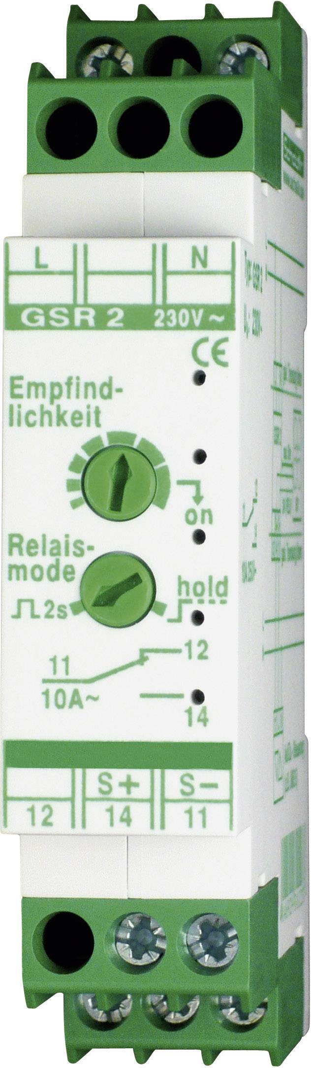 Electronic module in green and white, with controls and connections, labelled 'Sensitivity' and 'Relay mode', displaying 230V.