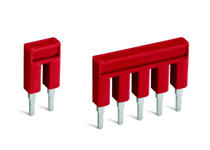 Two red short-circuit plugs with silver pins; one has two pins, the other five. They are pictured side by side.