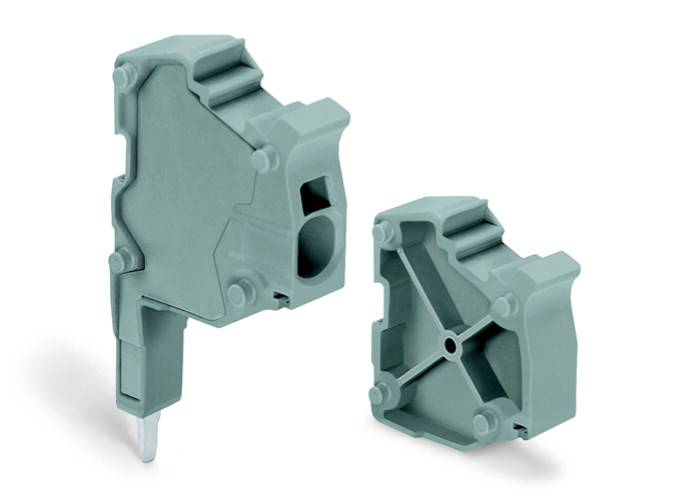 Two green, rectangular plastic enclosures with connector interfaces, potentially for electronic applications or assemblies.