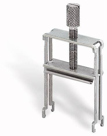 Metallic U-shaped clamp with a knurled screw head, standing on a white surface. Used for gripping or securing.