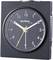 A black analogue alarm clock showing 10:09. The clockface has white numbers, with yellow and white hands.