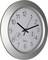 An analogue wall clock with a silver frame shows 10:09. Below the dial are two small indicators for temperature and humidity.