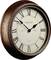 Round wall clock with Roman numerals and metal frame, showing approximately 10:10.