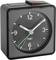 A black analogue alarm clock is showing the time as 10:10.