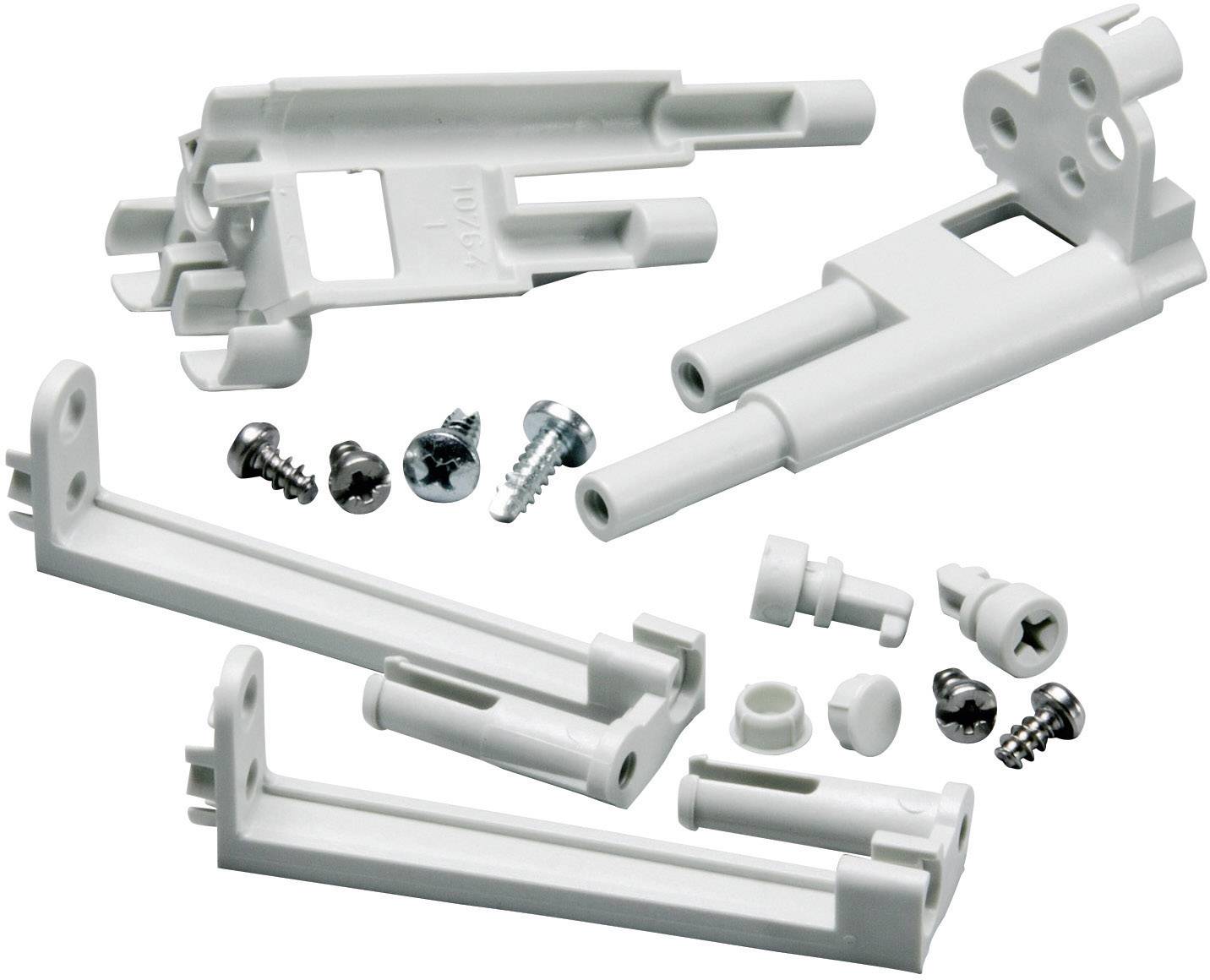 A set of white brackets and screws, likely used for mounting shelves or similar constructions.