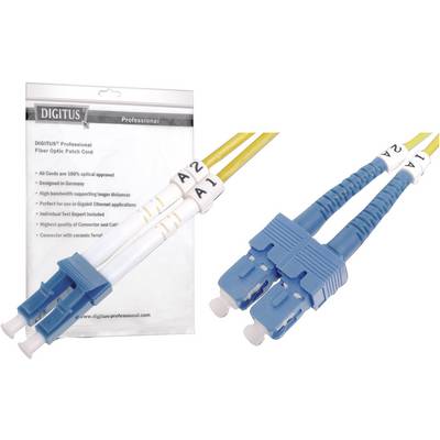Two LC cables with blue and yellow plugs side by side. In the background, a 'DIGITUS Professional' packaging.