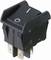 Black toggle switch with On/Off symbols, in the On position. Electronic component for electrical circuits.