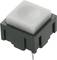 Square push switch with a black housing and a light-coloured, raised activation button for electronic applications.
