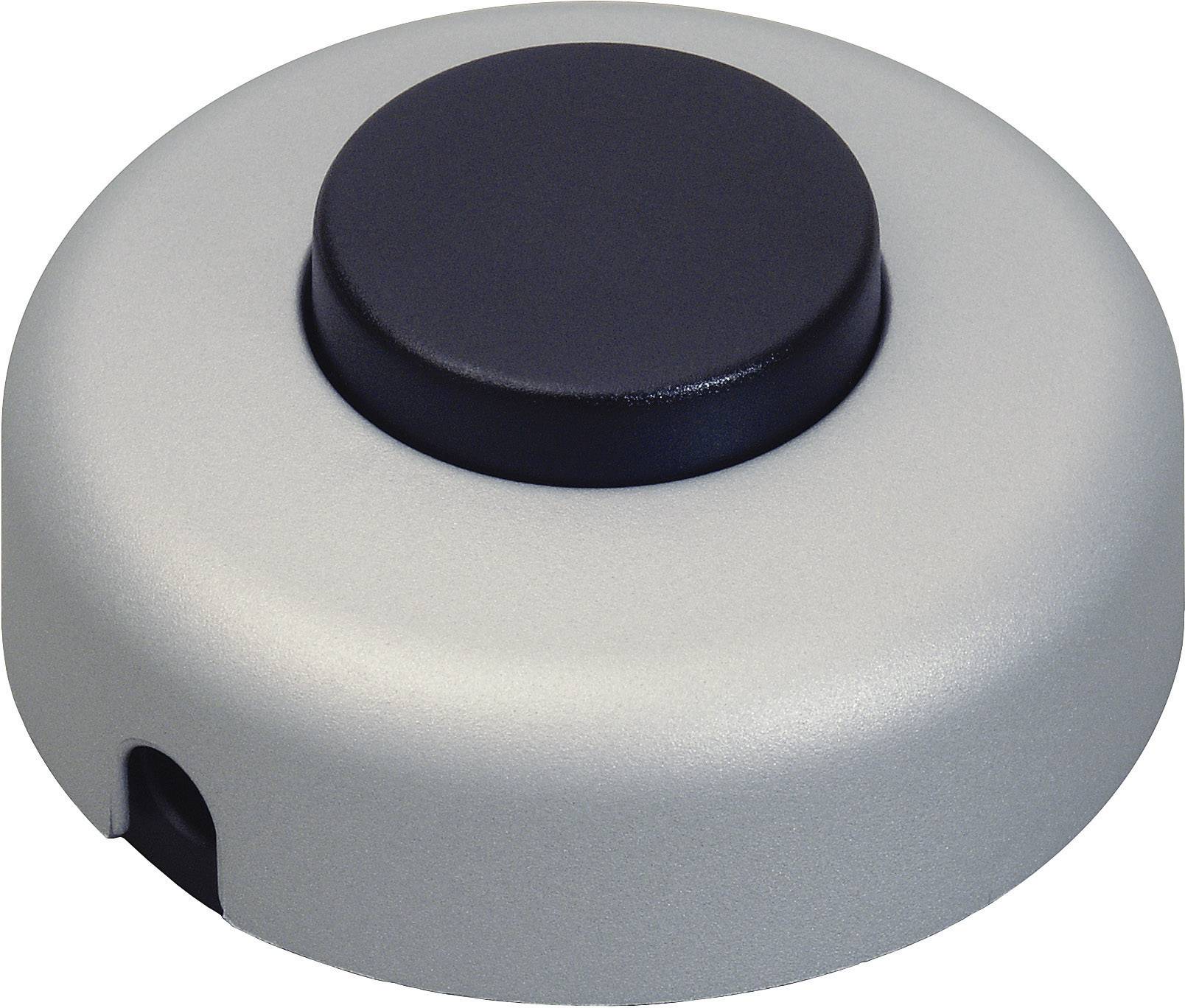 Round grey device with a black button on the top, possibly an electrical switch or doorbell.