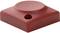 A red, square plastic component with a round protrusion in the centre and a circular hole in one corner.