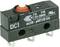 A black micro switch with a red button and labels for electrical specifications and approval marks.